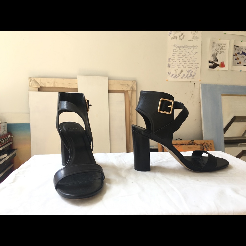 Black Cole Haan leather heels with gold buckle
